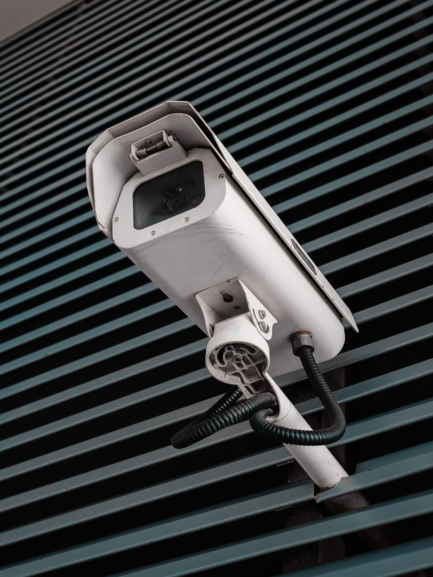 Security camera installed on a wall of the city.